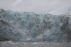 Travel to see these Ice blue glacier with streaks of black 