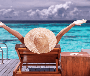 leisure travel lounging In Front of clear aqua water