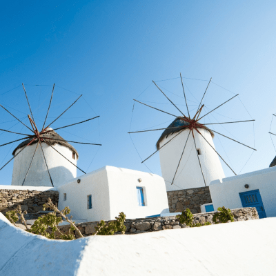 White windmills with a crisp blue sky