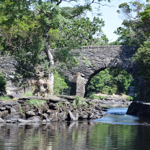 A stone bridge crossing on of the small rivers in Killarney National Park