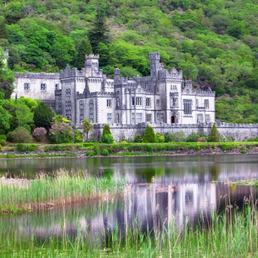 Kylemore Abbey reflecting in the water a long side it