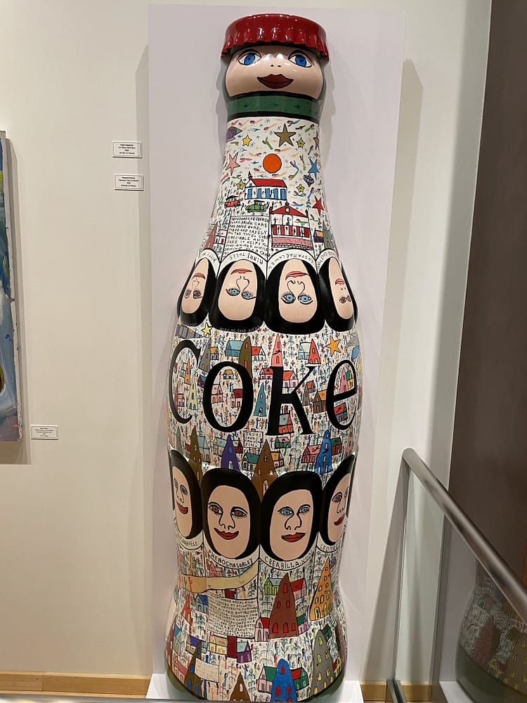 wood carved coke bottle